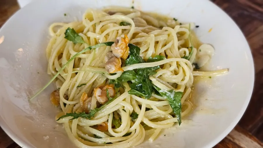 Plate of clam pasta with shells removed