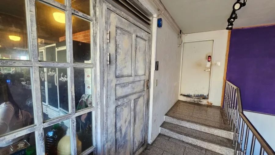 Hallway leading to the restroom inside Low Five