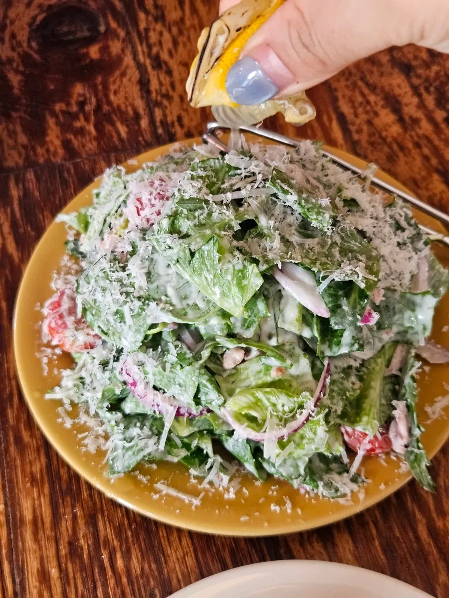 Caesar salad served with a torched lemon