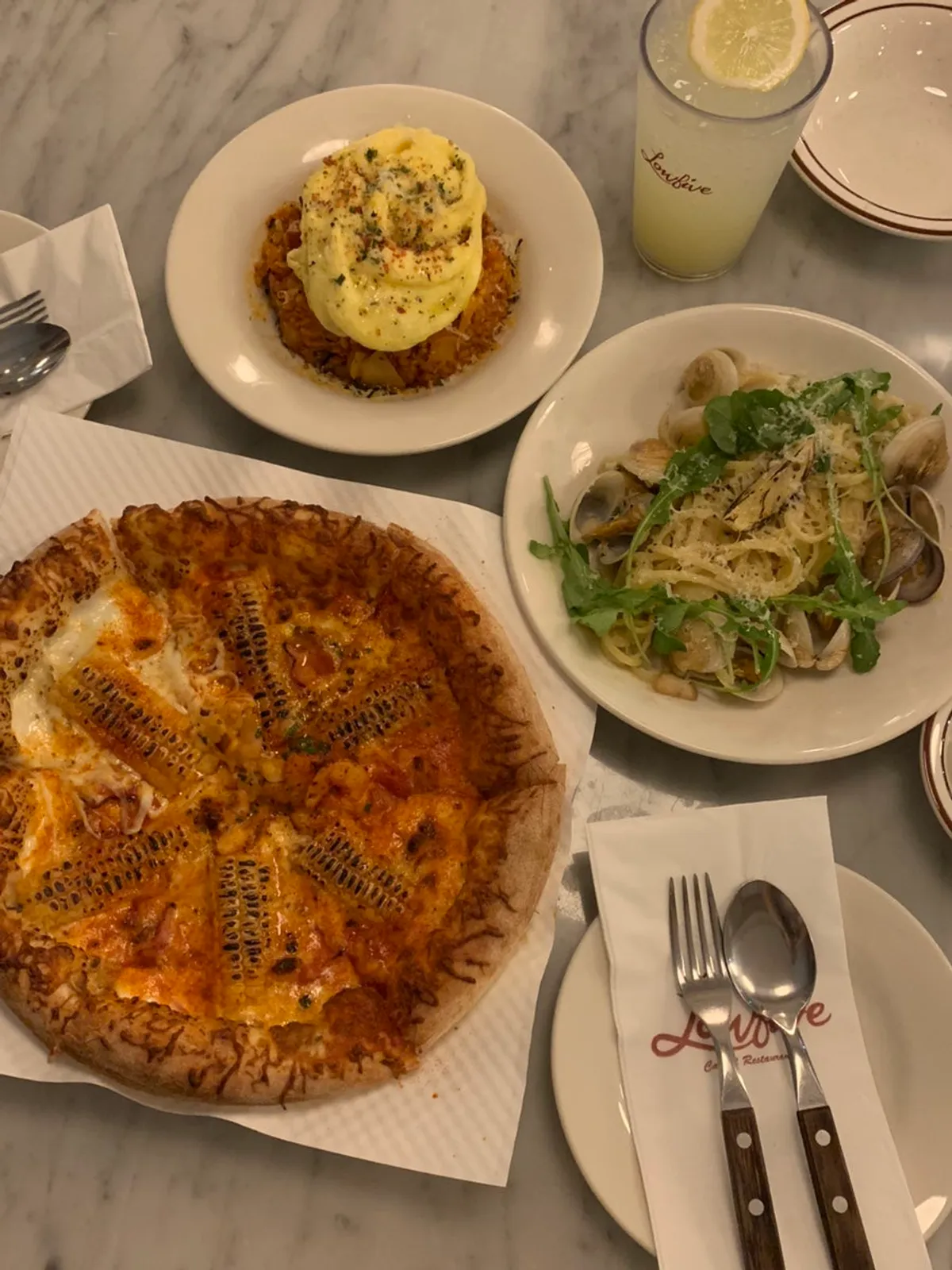 Spread of corn pizza, kimchi fried rice, and vongole pasta