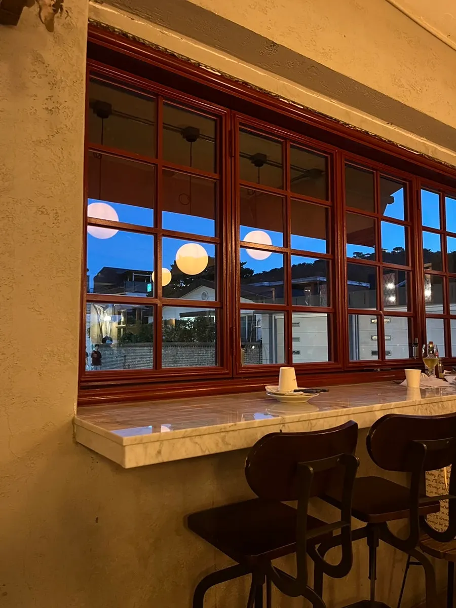 Window seating for two with a view of the street outside