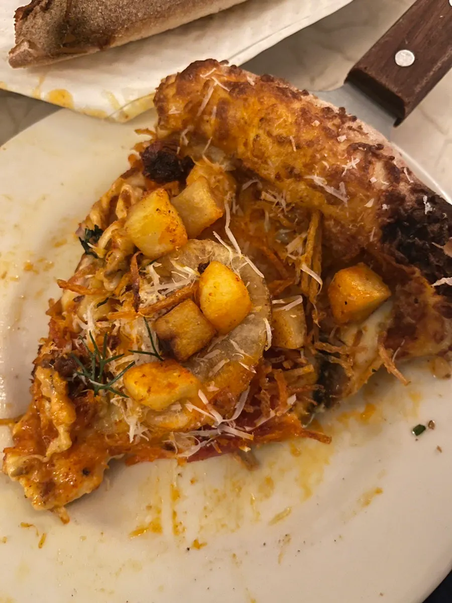 Hot chili potato pizza topped with fried potato pieces
