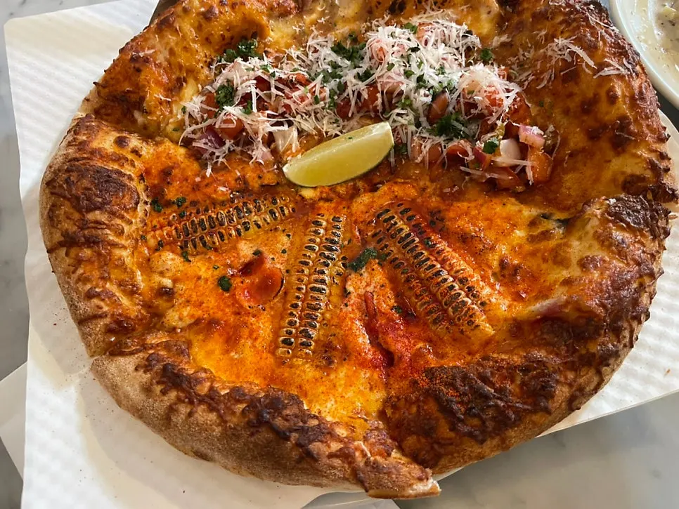 The half-and-half pizza set on the table