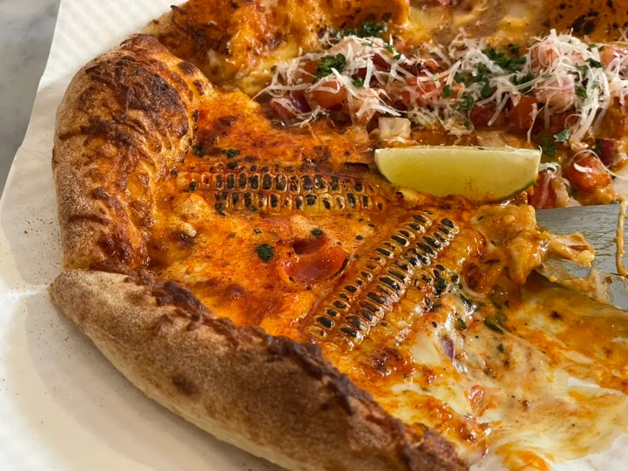 Cross-section of the white truffle cream-based corn pizza
