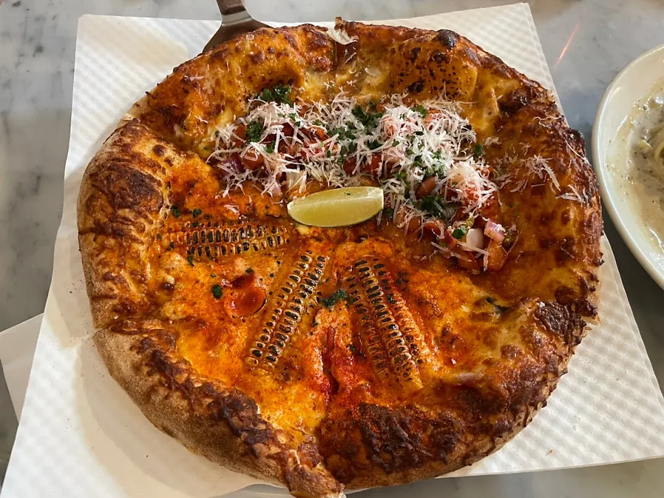 Tex-Mex taco pizza topped with cilantro