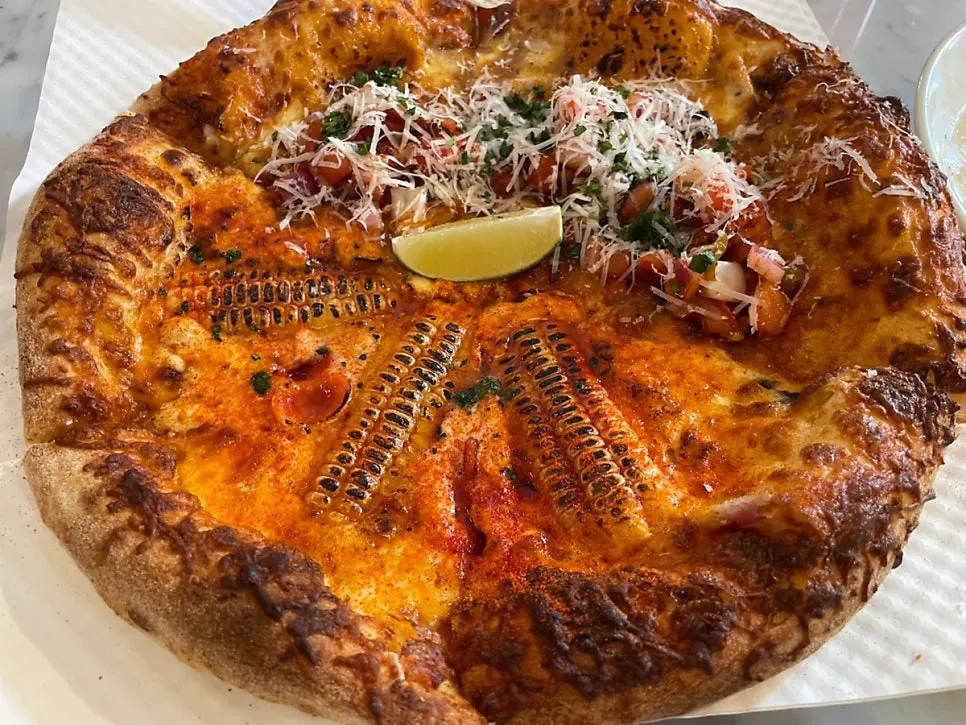 Close-up of a slice of taco pizza