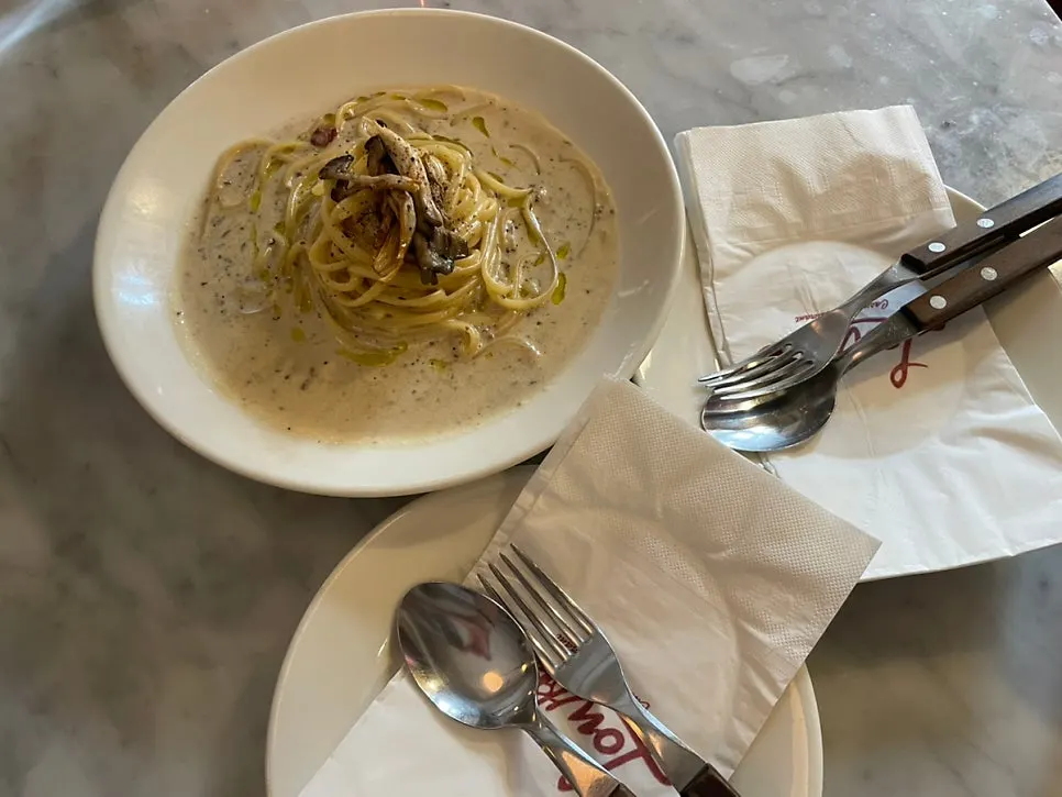Truffle cream pasta topped with grilled mushrooms