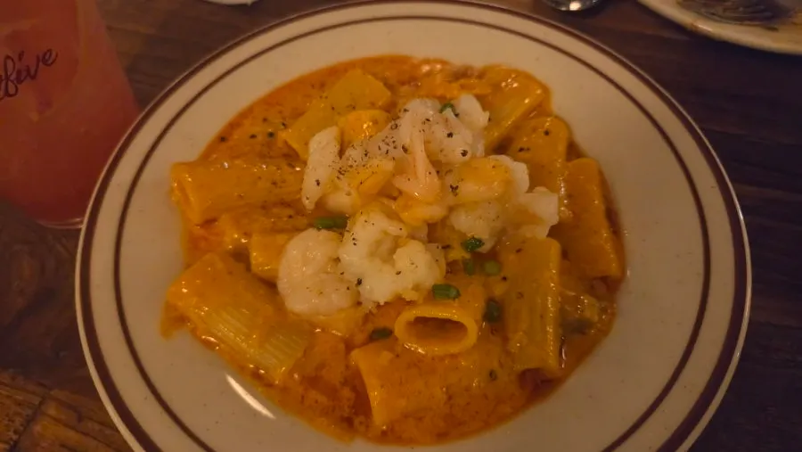 A regular-size half-and-half pizza and pasta spread
