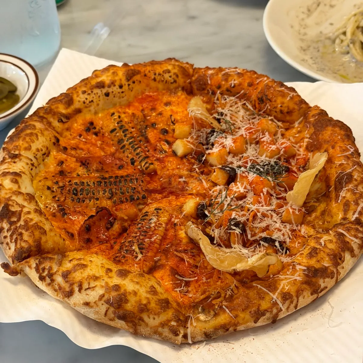Half-and-half pizza with corn pizza and hot chili potato