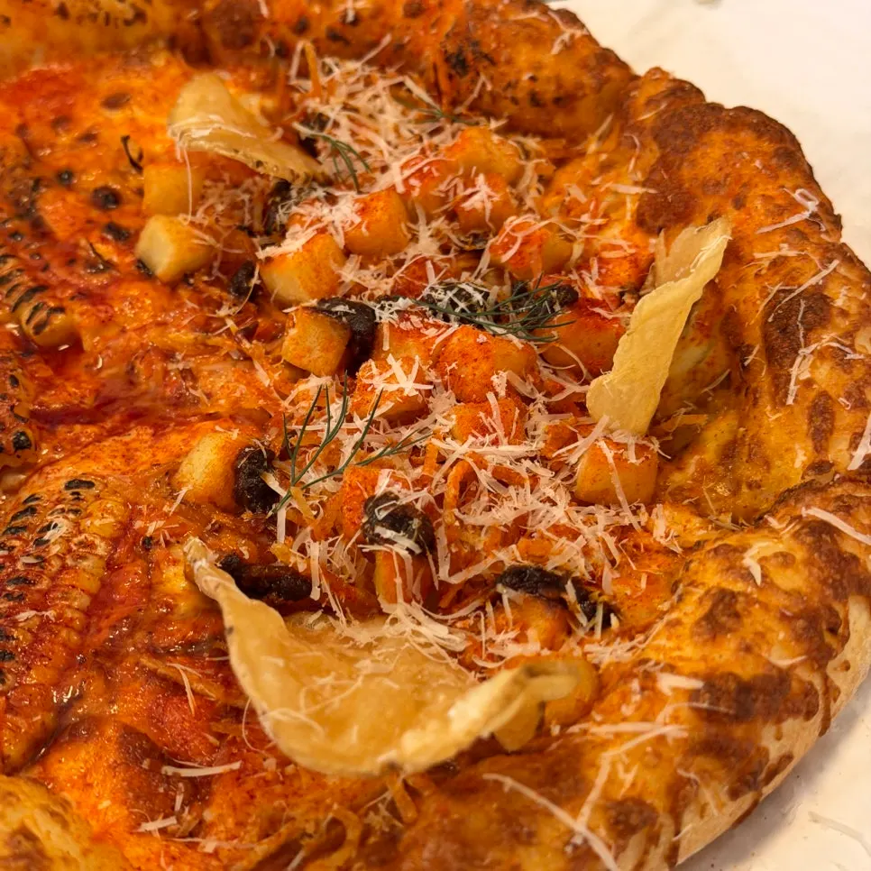 Cross-section of a slice of corn pizza