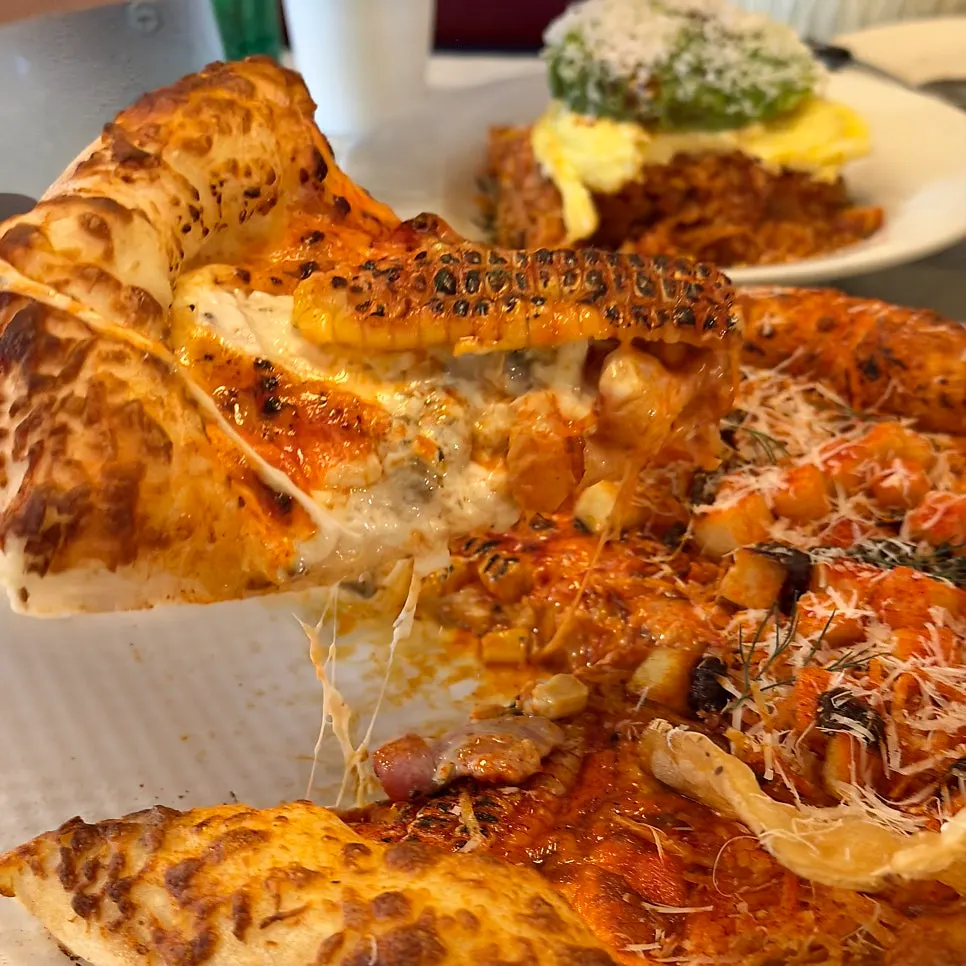 A slice of hot chili potato pizza