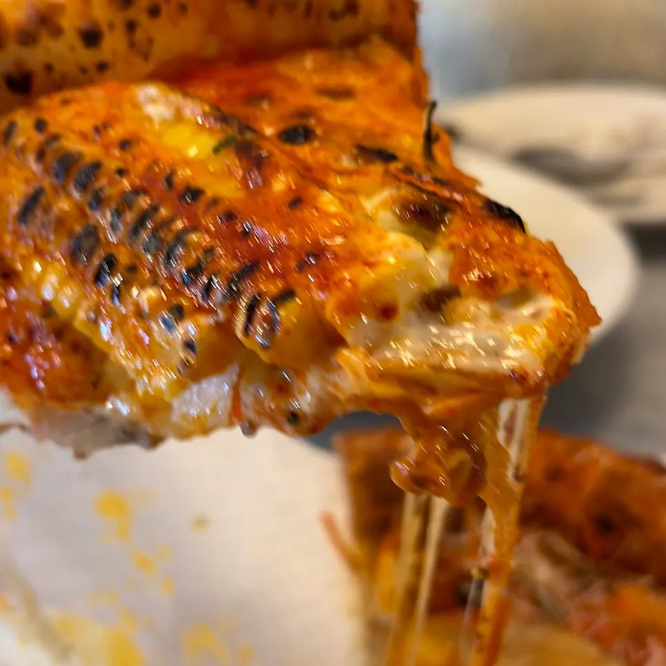 The crispy, chewy end of the pizza crust