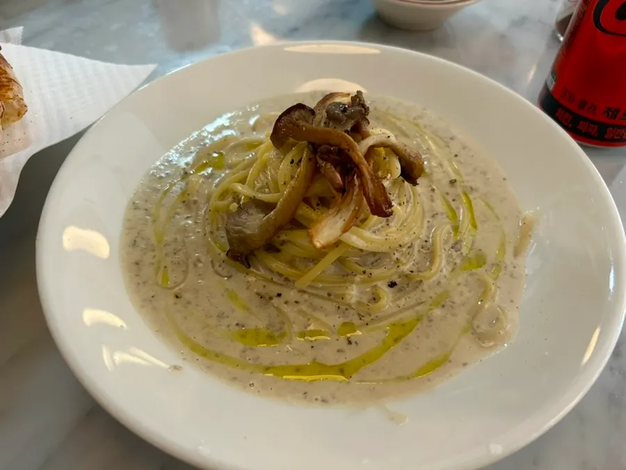 A plate of truffle cream pasta