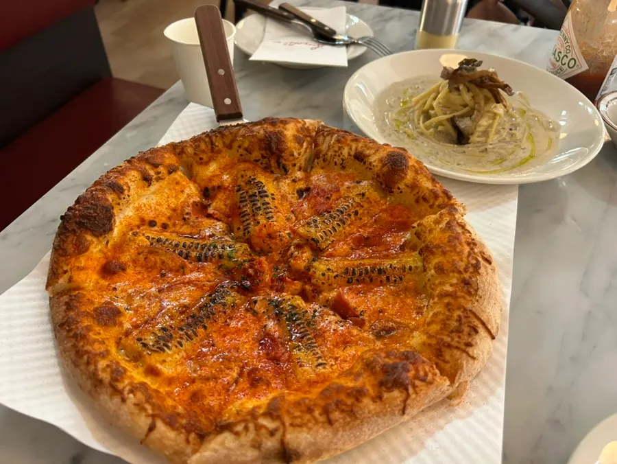 Table set with pizza and pasta together