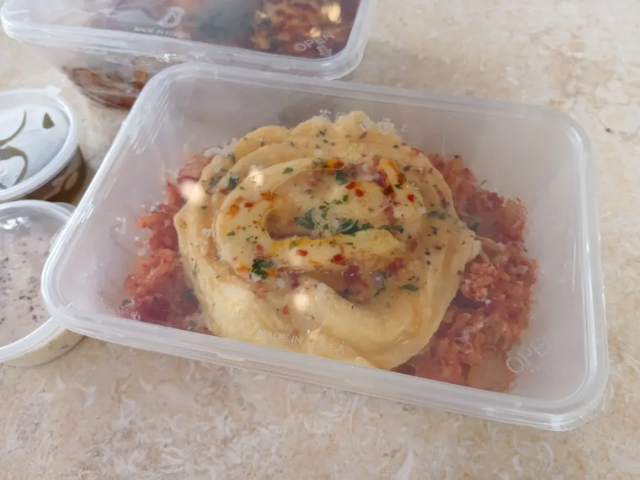 Cross-section of lasagna showing ragu sauce