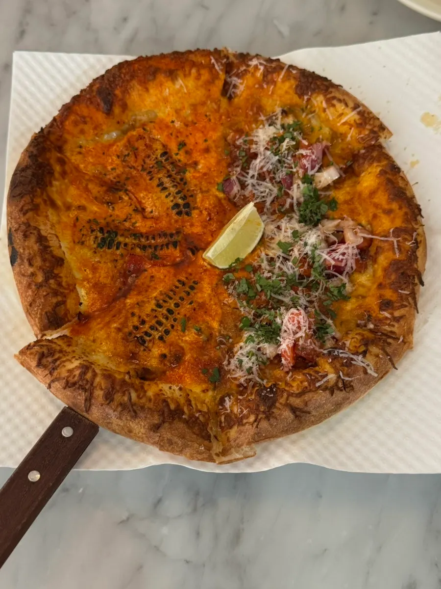A whole corn and taco half-and-half pizza