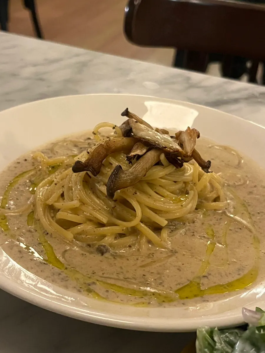 A plate of thick, creamy truffle cream pasta