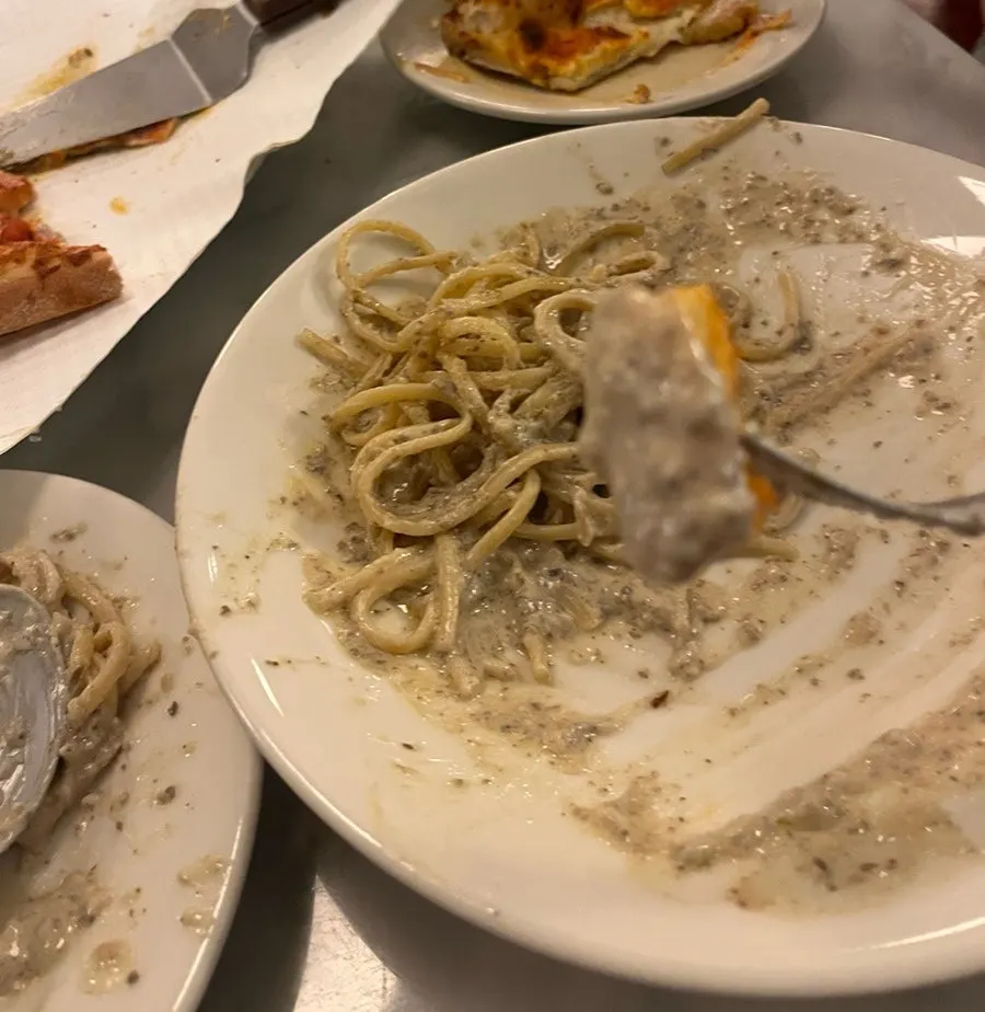 Table set with pizza and pasta together