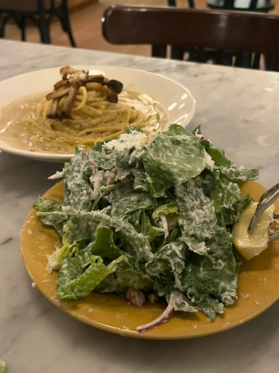 Salad and drink laid out on the table