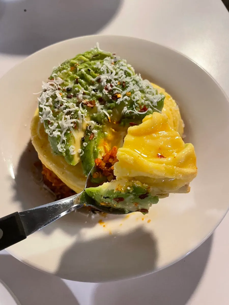 Kimchi fried rice topped with avocado and egg