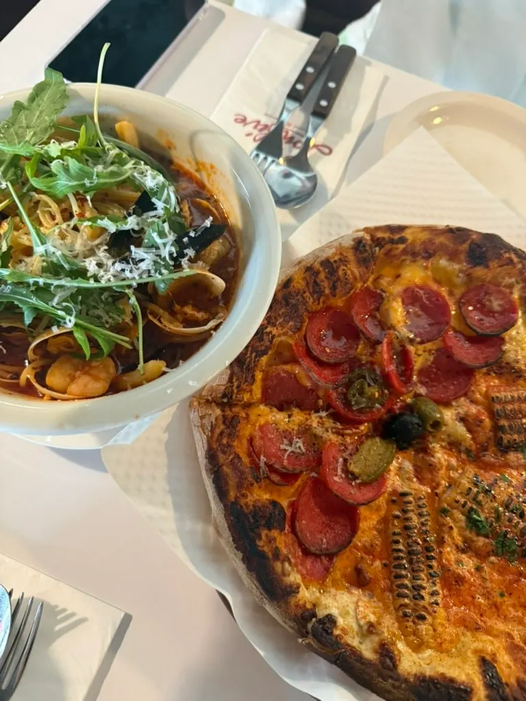Close-up of the half-and-half pizza and pasta
