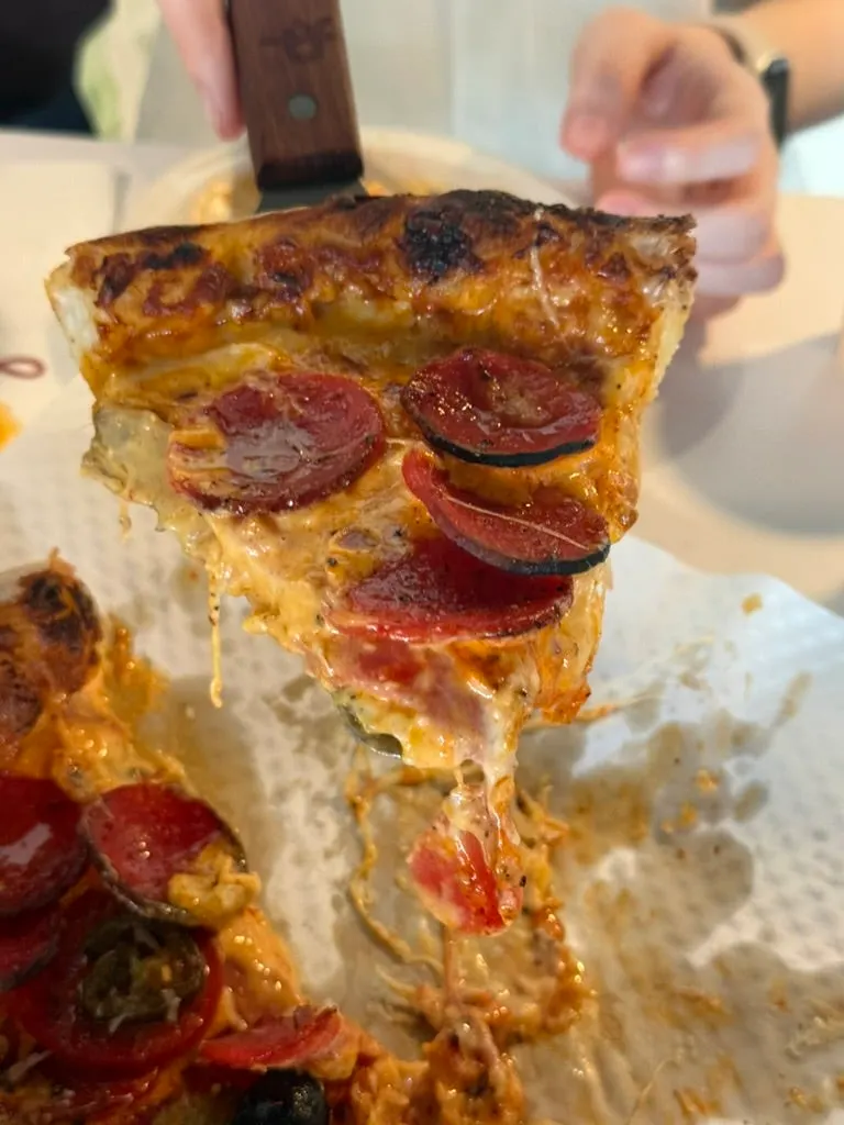 Pepperoni pizza with cheese and sauce blended together