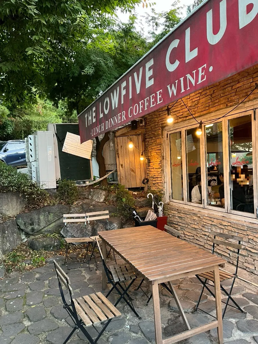 Nighttime view of the front of Low Five