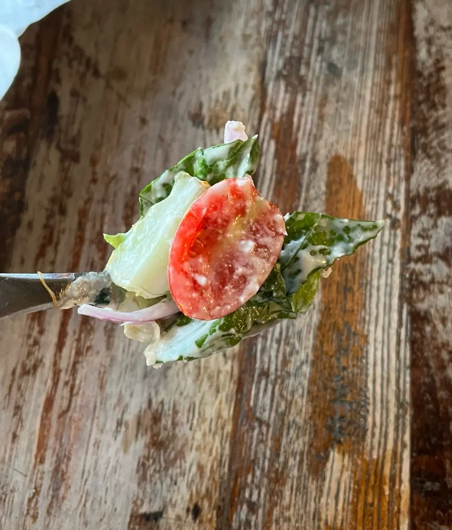 Close-up of salad topped with Reggiano cheese