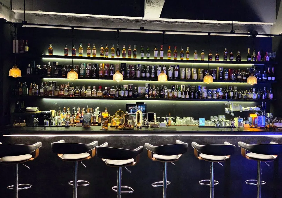 Long bar table inside Lucent Bar