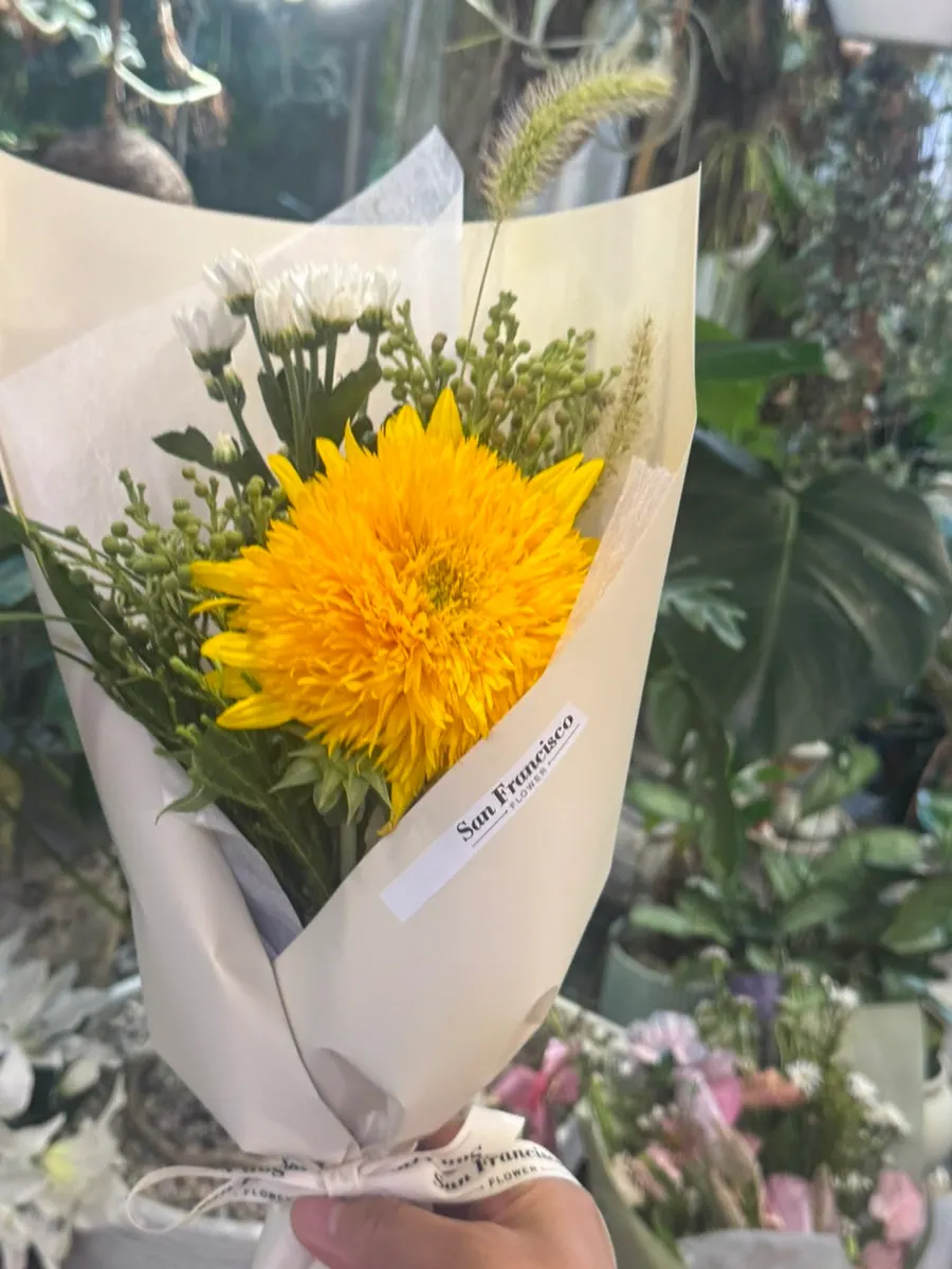 A teddy bear flower bought from the flower shop next door
