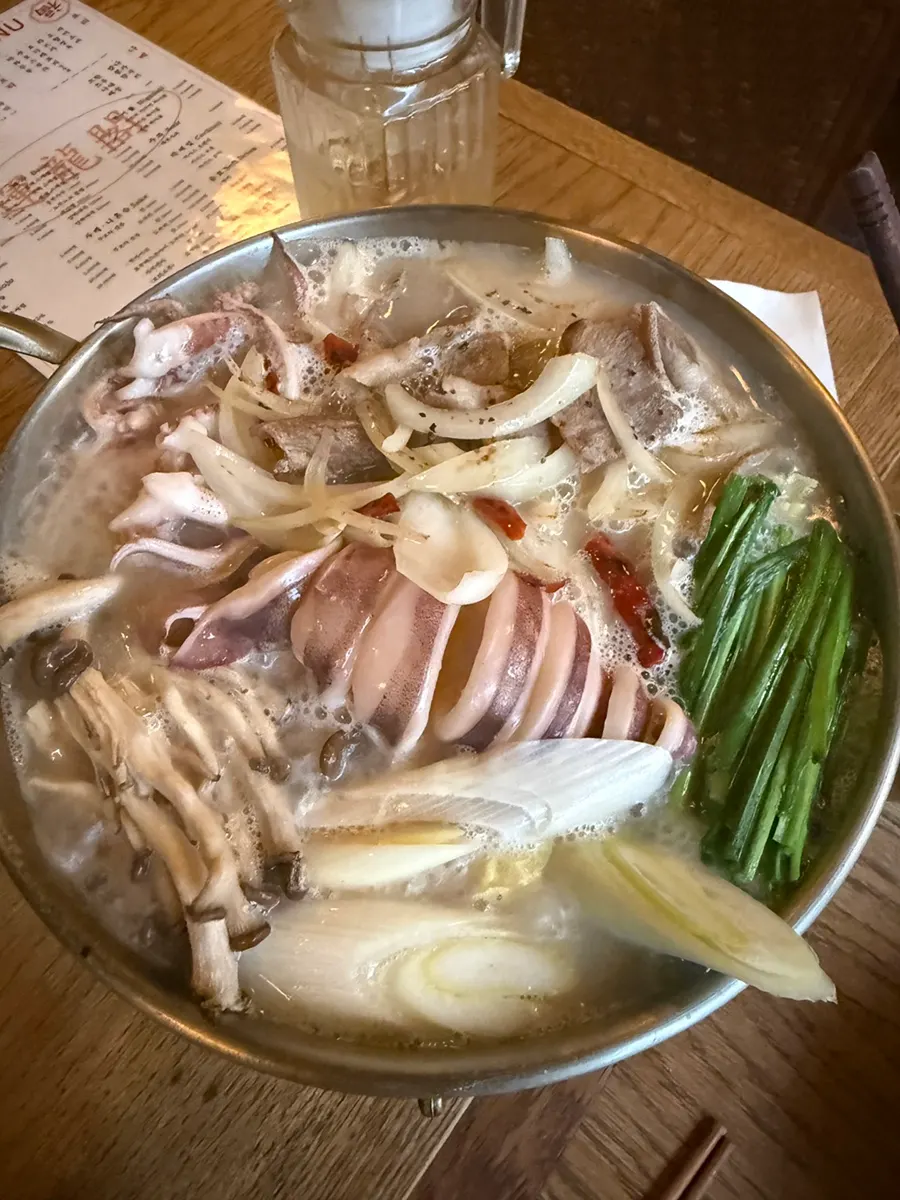Overhead shot of the jjamppong soup with the whole squid