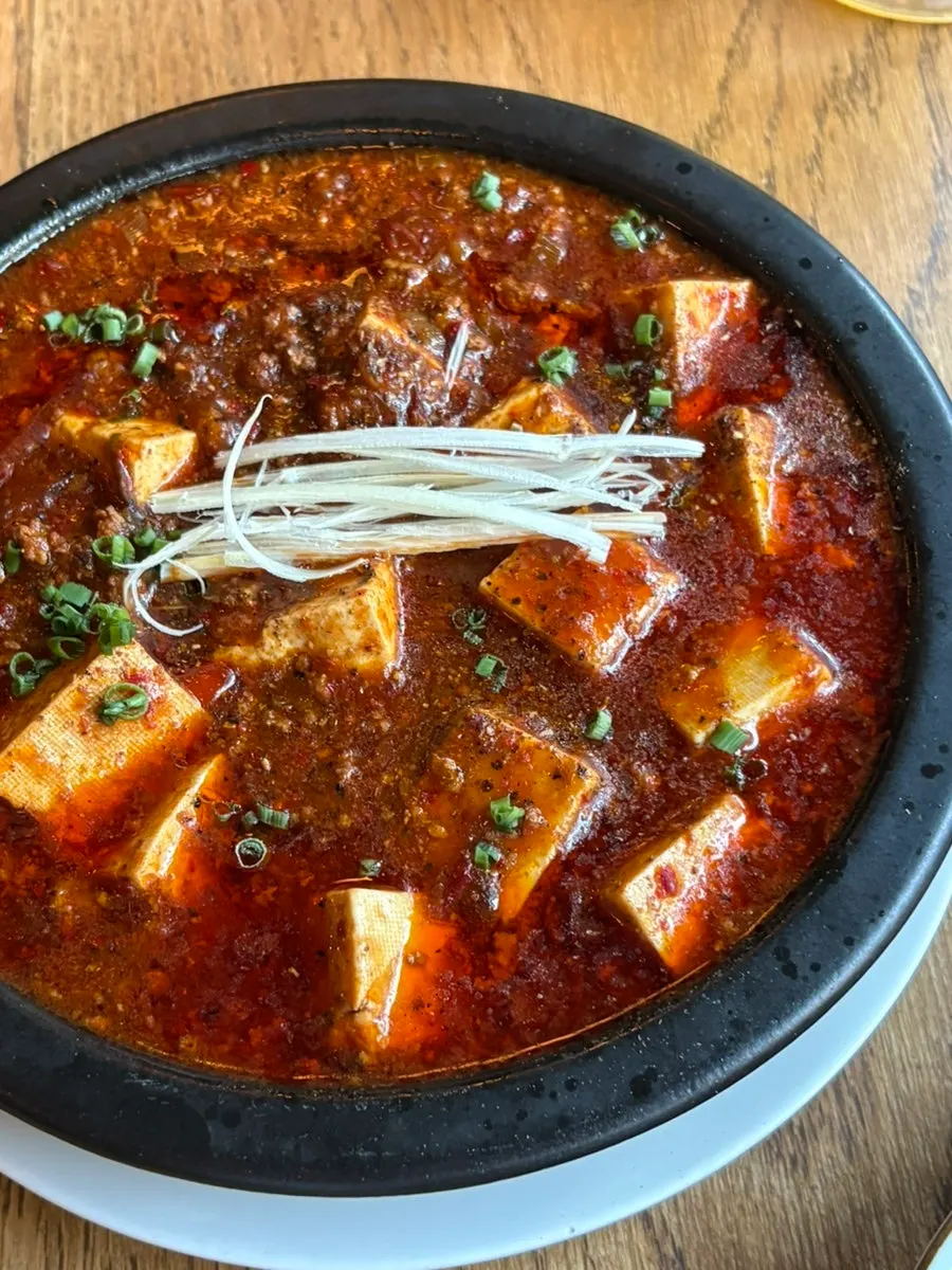 Mapo tofu spooned onto a small plate
