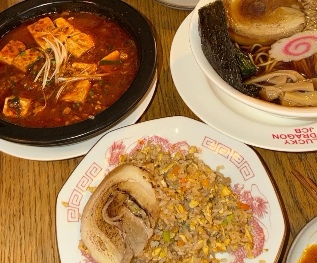 A table set with char siu chahan, mapo tofu, and chuka soba