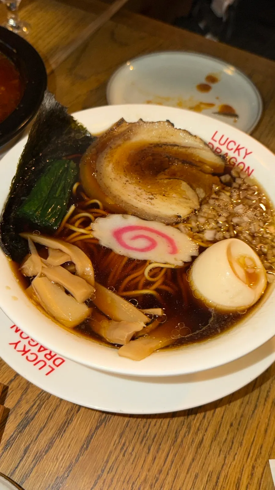 Chuka soba topped with char siu, egg, seaweed, and menma