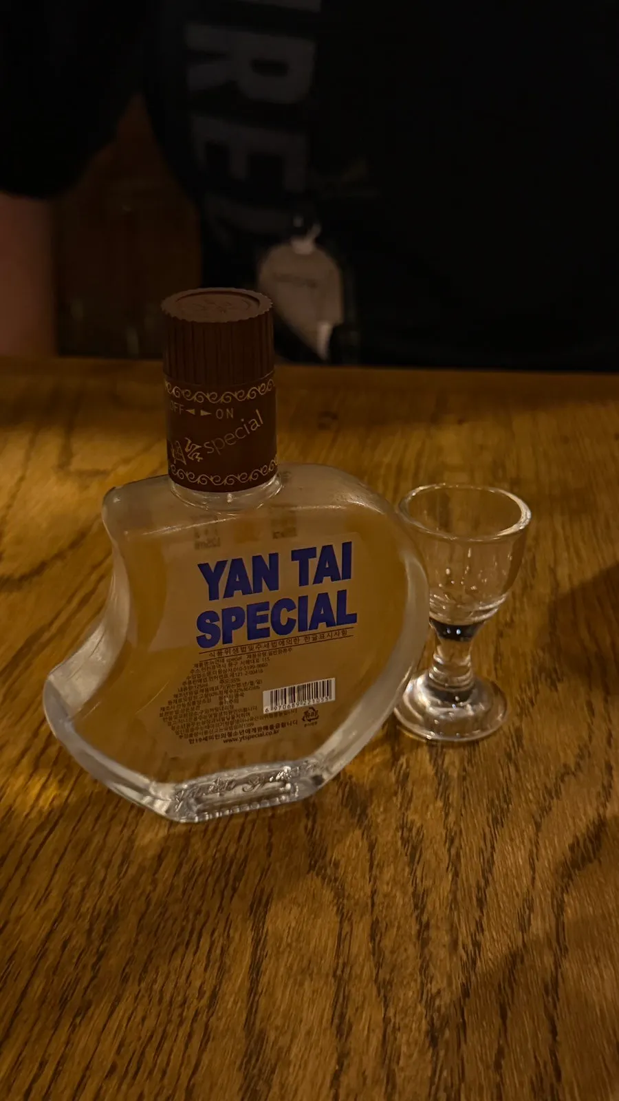 A bottle and glass of Yantai Special 125ml