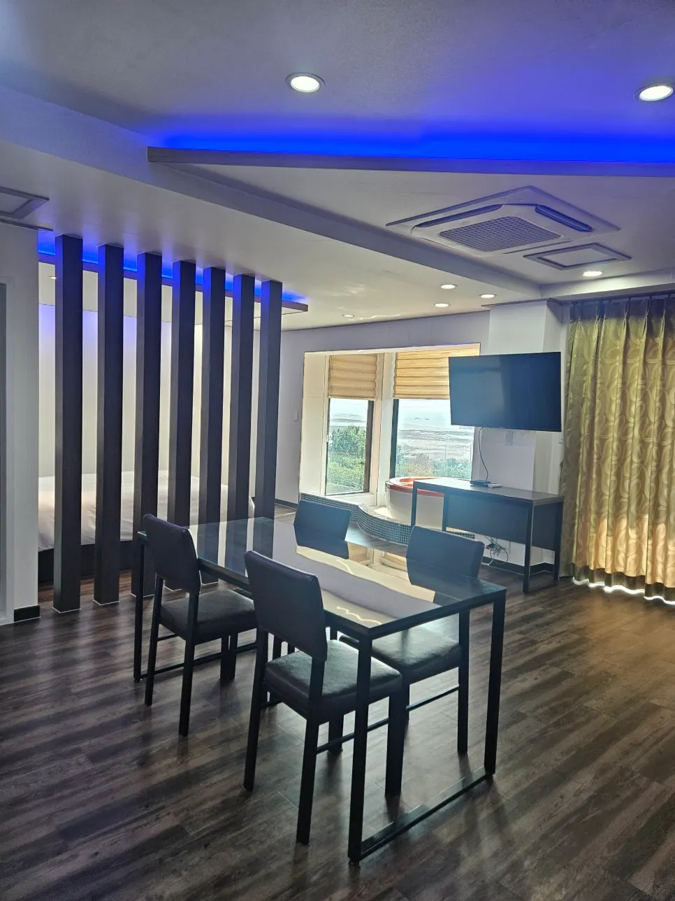 Spa room entrance lit by a blue mood light