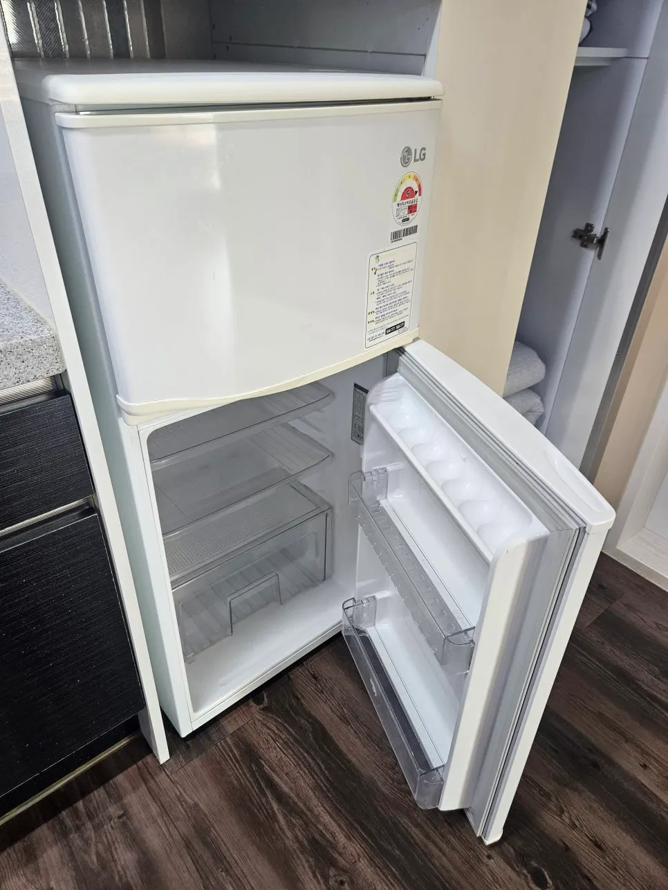 Empty interior of the in-room fridge