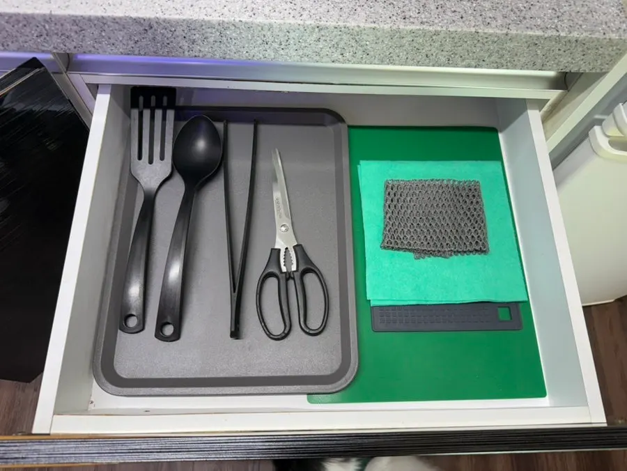 Hair dryer, towels, and bedding set provided in the room