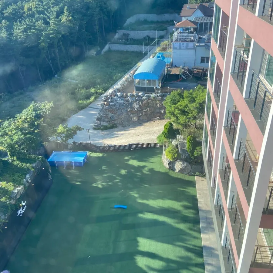 Outdoor pool seen through the picture window