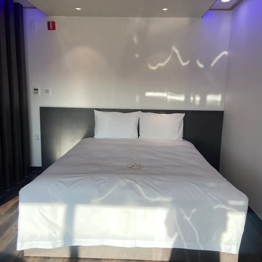 Room view with the ocean visible through the picture window