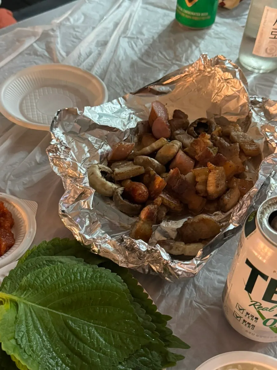Sausages and king oyster mushrooms on the grill