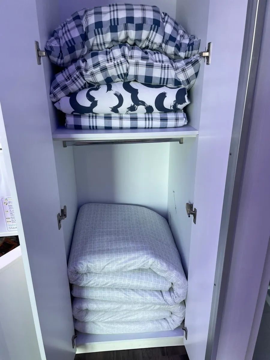 Bedding on the two beds in the twin room