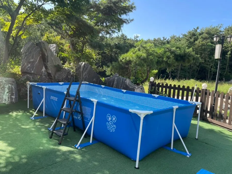 Pool with tubes and life vests laid out