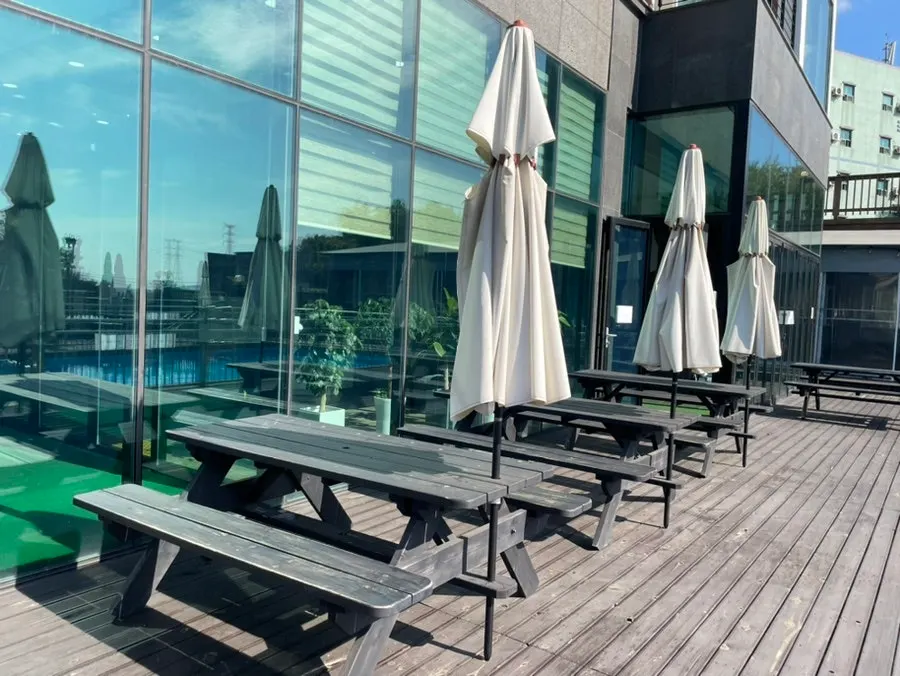 Outdoor barbecue table under a parasol