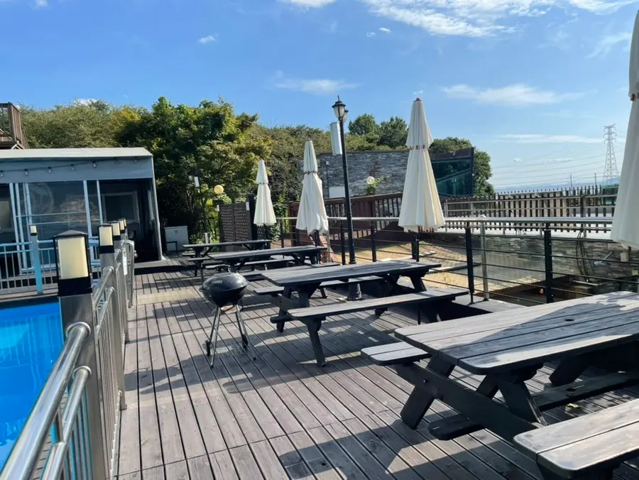 View of the outdoor barbecue area in front of the pool
