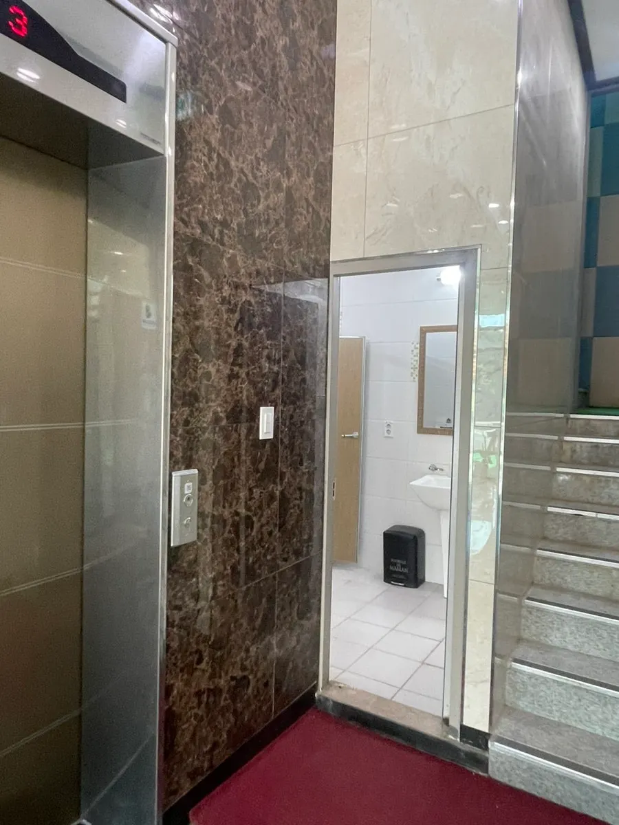 Entrance to the ground-floor restroom near the barbecue area