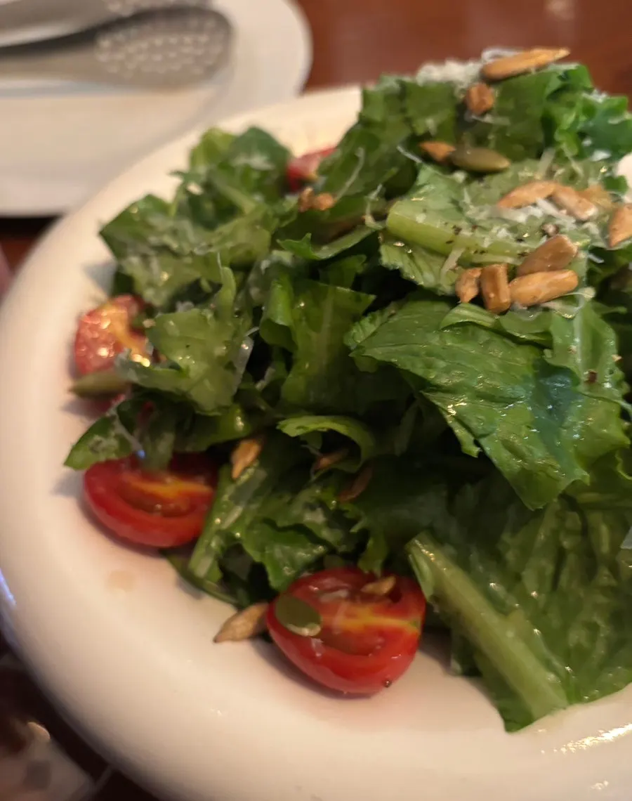 Close-up of the house salad with dressing