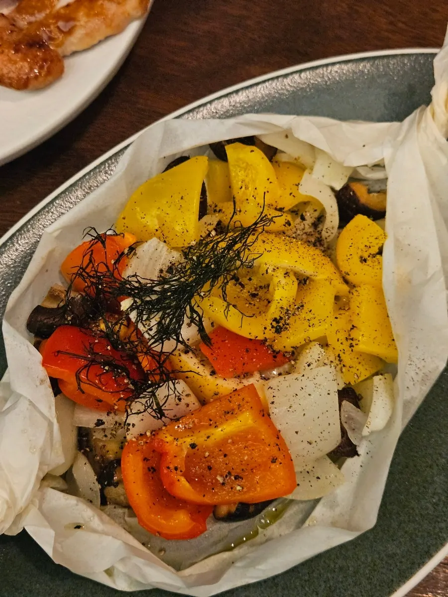 Oven-roasted napa cabbage topped with a cheesy garnish