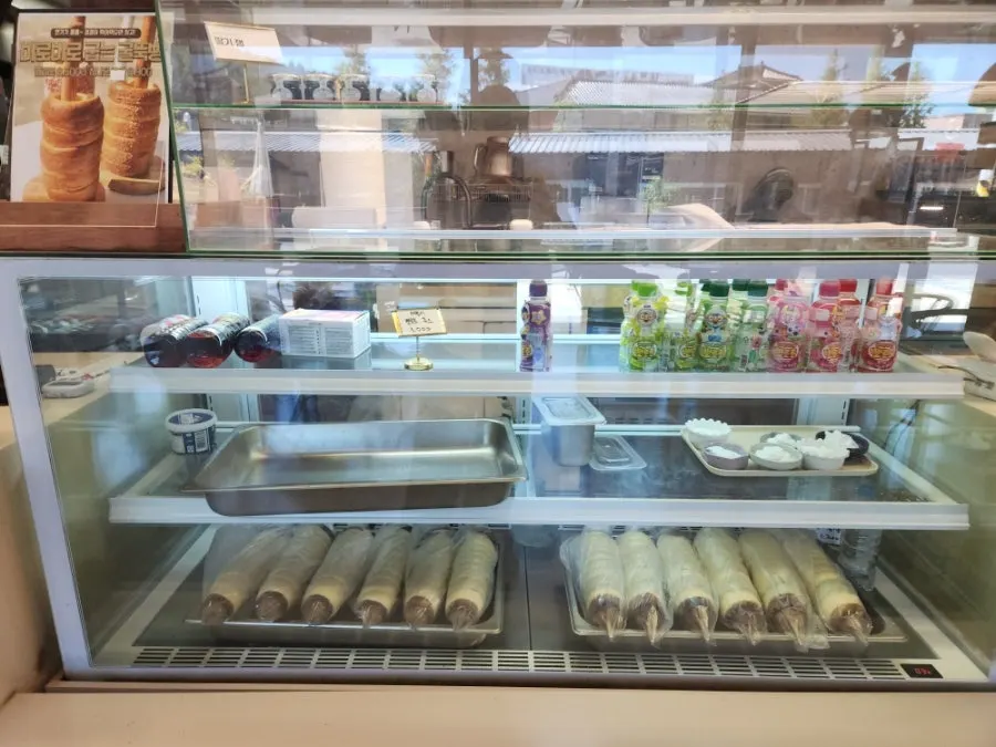 Kids' drink menu and chimney bread dough display case
