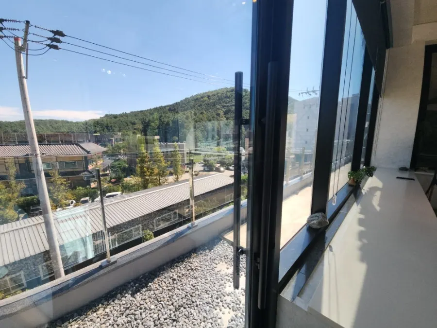 3rd floor terrace seating seen through the window